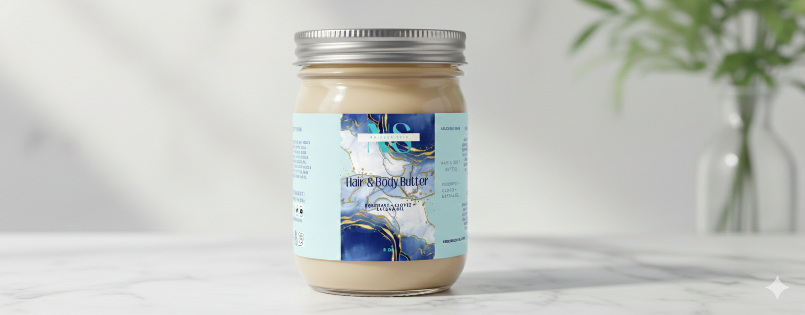 Jar of Body Butter with a label on a white surface